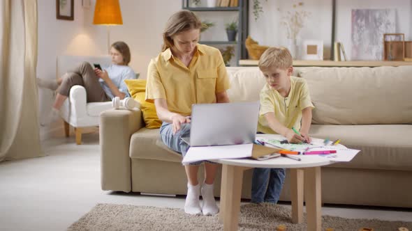 Sequence of Boy Drawing on Mothers Document alt