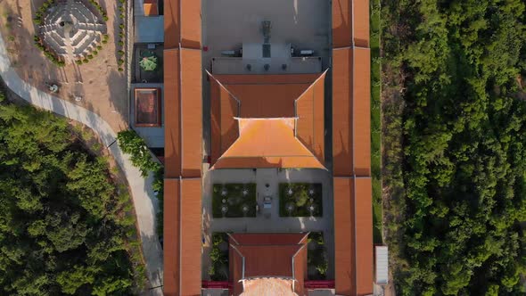 Rising top down aerial view of traditional Chinese temple in Macau alt