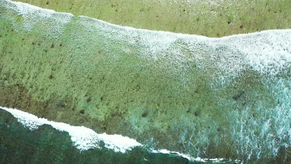 Natural flying abstract shot of a sandy white paradise beach and aqua blue water background  alt