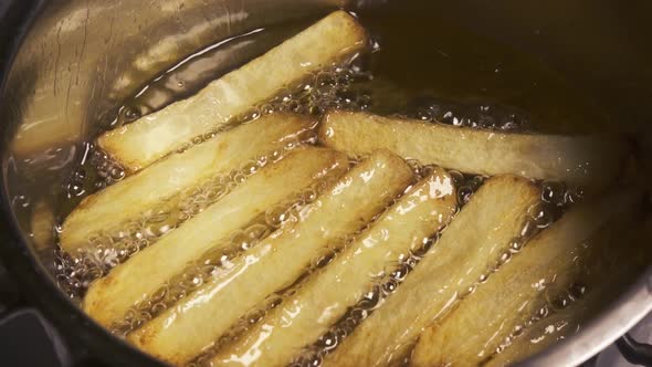 Slow Motion Fry Potatoes in Oil