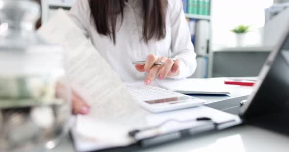 Business Woman Financial Paperwork and Checking Amount Savings Bank Account alt