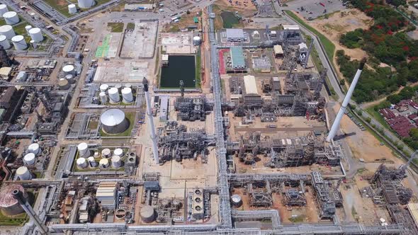 Aerial view of petrochemical oil refinery and sea in industrial engineering alt