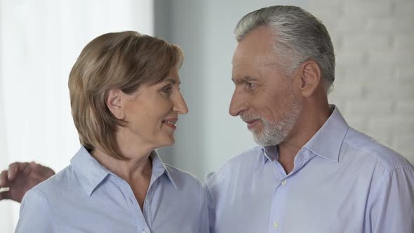 Aged Man and Woman Looking at Each Other, Putting Heads Together, Family Harmony alt
