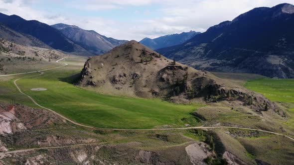 Drone flying over mountains and valleys alt