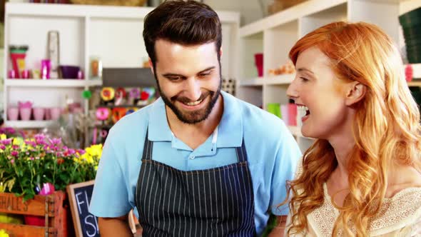 Florists giving high five to each other alt