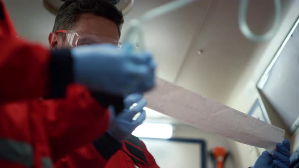 Paramedics Giving First Aid to Man alt