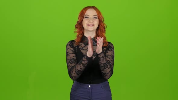 Girl Stands and Applauds a Good Performance, She Is Happy. Green Screen alt
