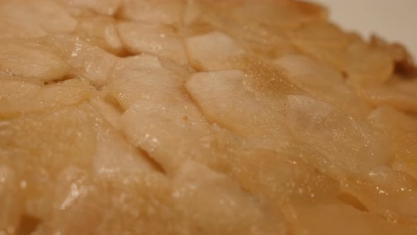 Slow pan on baked fruit cake texture served 4K 2160p 30fps UltraHD footage - Apple pie surface after alt