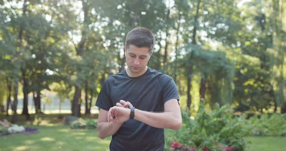 Man Runner Using Smart Watch After Workout alt