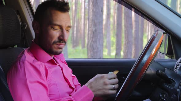 Upset Businessman Counts Dollar Bills is Sad and Speaks to the Camera alt