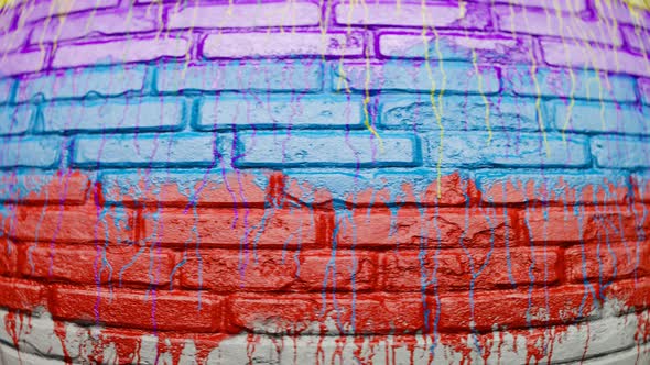 Colorful paint leaks on an old brick wall. Endless looping animation. 4KHD alt