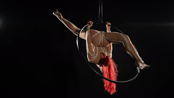 Wide Shot Slim Young Woman Spinning on Air Hoop in Upside Down Split alt