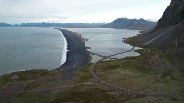 Drone Over Landscape With Road And Black Beach Near Estrahorn Mountain alt