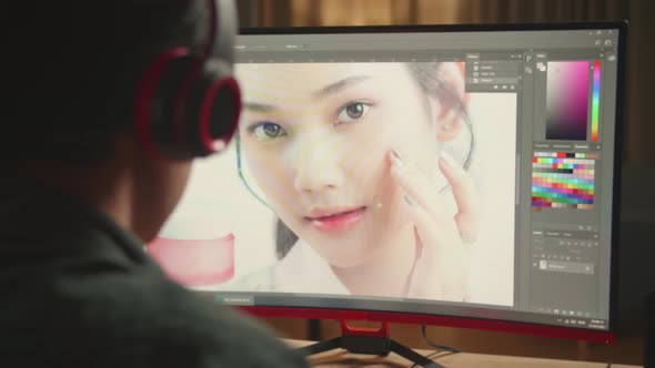 Close Up Asian Male Digital Editor Works In Photo Editing Software On His Personal Computer alt