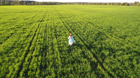 Girl Running On Sunlight Field 1