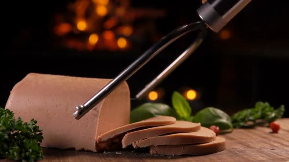 Special Knife Cuts of Foie Gras on a Wooden Board alt