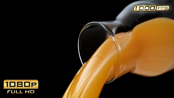 Pouring Fruit Juice out of a Bottle alt