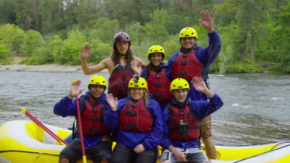 Group portrait of people white water rafting