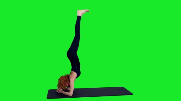 Sporty Female in Black Bodysuit Doing Yoga Exercise Against Green Screen