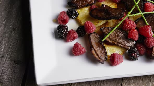 Rotating - smoked duck bacon with grilled pineapple, raspberries, blackberries and honey alt
