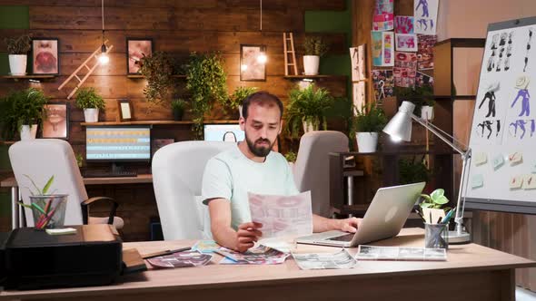 Experienced Art Director Working on His Desing for a New Project alt
