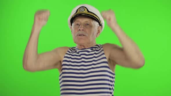Elderly Sailor Man Funny Dances. Old Sailorman on Chroma Key Background alt