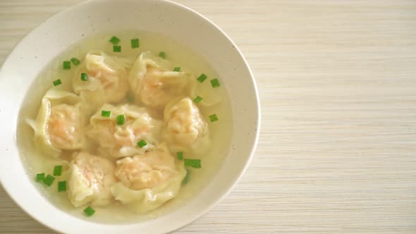 shrimp dumpling soup in white bowl - Asian food style alt