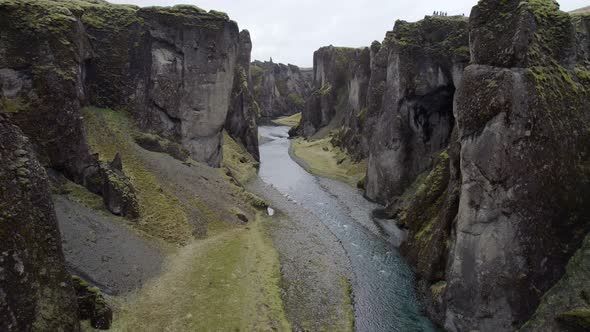 Flying up river through the massive walls of the majestic Fjadrargljufur canyon alt