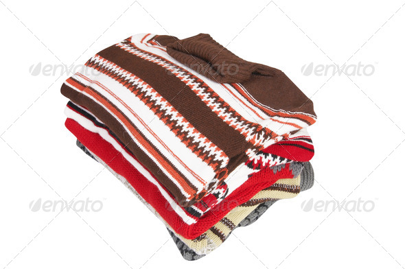 Colorful sweaters on a white. - Stock Photo - Images