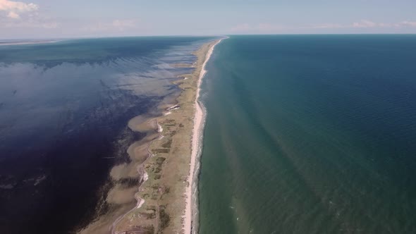 Aerial Shot of a Boundless Limestone Sandspit on the Black Sea in Summer