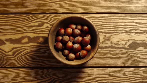 Unpeeled Hazelnuts Appear In Wooden Cup And Full This Cup