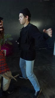 Dance Battle of Two Young Teenagers Standing Together and Gesturing Hands Up alt