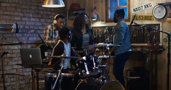 Young Musicians Rehearsing in Garage alt