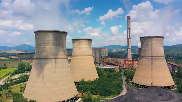Aerial View Of The Nuclear Power Plant With Big Chimneys The Blue Sky On The Background