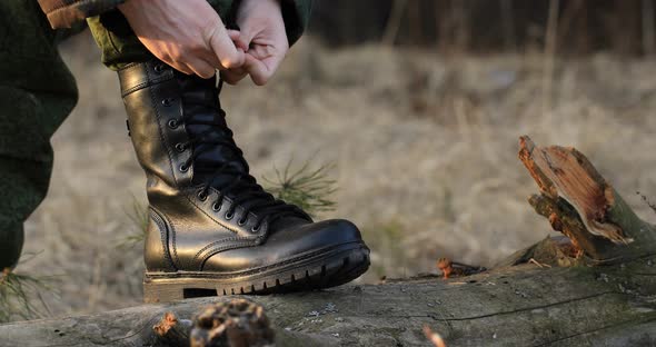 army boot on a log in nature, nature alt