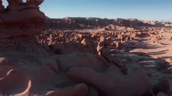 Aerial Panoramic View Tourist Attraction Goblin Valley in Golden Sunrise Light alt