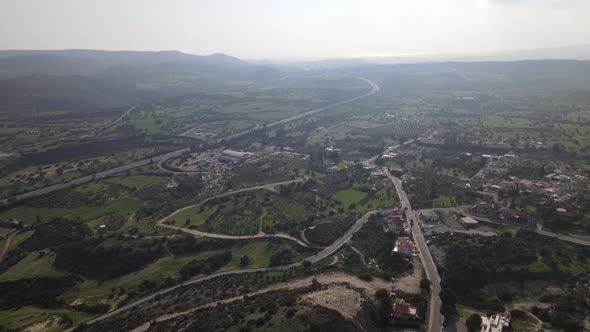 Types of Cyprus in the mountains. Top view of the mountains and human structures.