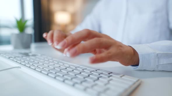 Female Hands Typing on a Computer Keyboard alt