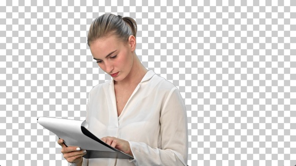 Young businesswoman reading documents, Alpha Channel