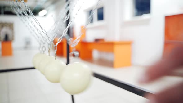 Balancing balls of Newton's cradle. Museum of Science alt