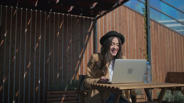 Lovely Girl in a Park with Her Personal Laptop alt