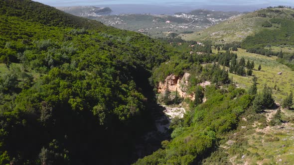 Erosion canyon in mountain forest landscape at Llogara National Park, Albanian Ionian Sea Coast. aer alt