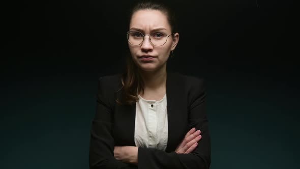 Displeased office executive shakes his head to the side in accusation alt