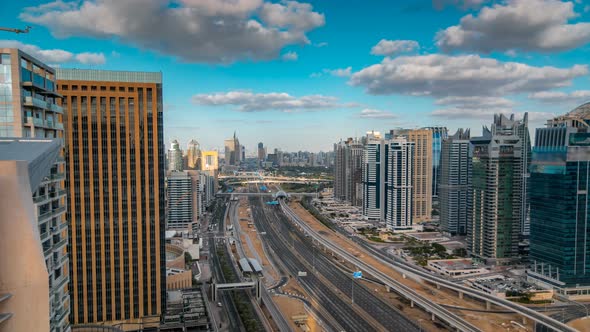 Aerial View of Dubai Marina Skyscrapers and Jumeirah Lakes Towers Timelapse with Traffic on Sheikh alt