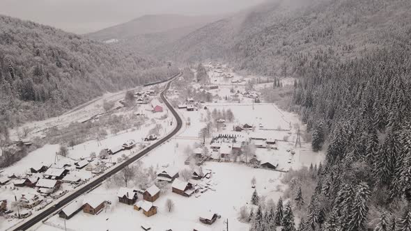 Snow Covered Village in the Winter Mountains