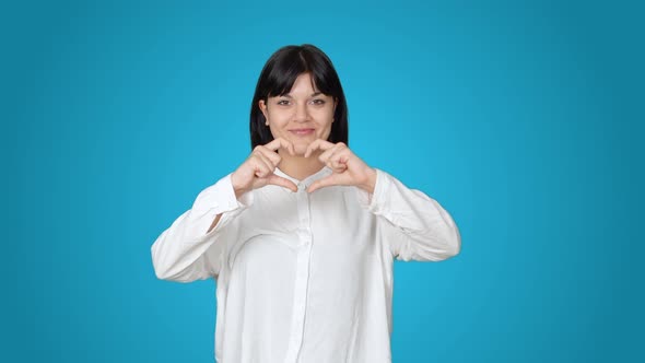 Making heart with female hands. alt