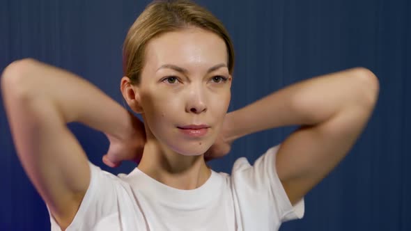 Self-massage of Neck and Chin, Woman Demonstrates, Preventions of Osteochondrosis alt