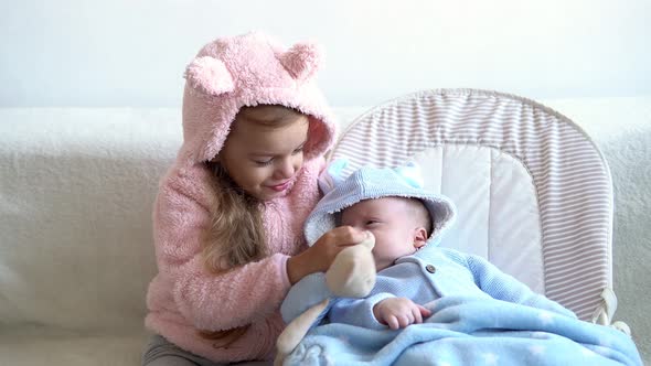 Friendship Family Infant Childhood Two Little Smiling Toddler Children Baby Relax Playing with Teddy
