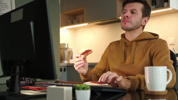 Tired Man Works Late at Workplace Use Computer alt