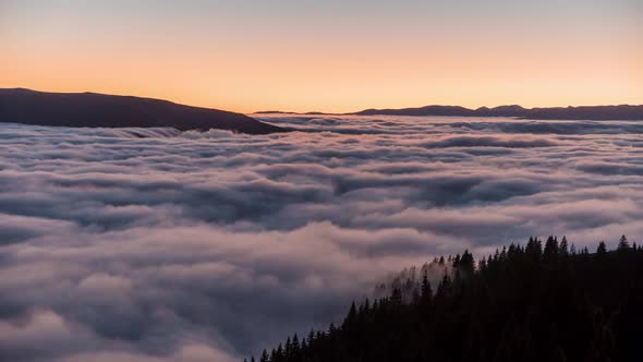 Time Lapse of Fog over Mountains at Sunset 